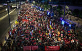 Demonstrators calling for the release of Israeli hostages held in the Gaza Strip march in Tel Aviv, June 5, 2024. (Itai Ron/Flash90)