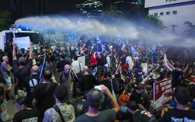 Demonstrators clash with police during a protest calling for the release of hostages held in the Gaza Strip outside Hakirya Base in Tel Aviv, June 8, 2024. (Erik Marmor/Flash90)