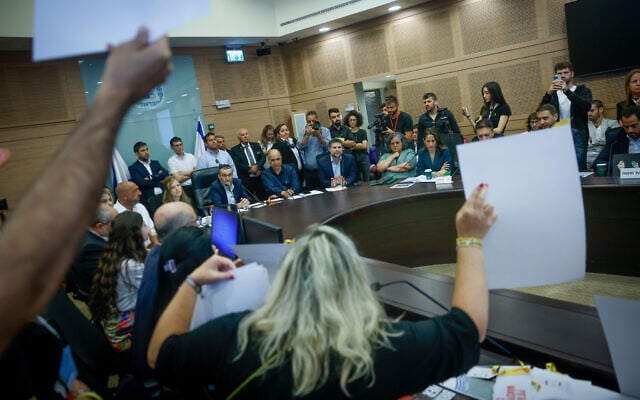 Relatives of Israelis held hostage in the Gaza Strip react to Finance Minister Bezalel Smotrich during a Finance Committee meeting at the Knesset on June 10, 2024 (Chaim Goldberg/Flash90) Relatives of Israelis held hostage in the Gaza Strip react to Finance Minister Bezalel Smotrich during a Finance Committee meeting at the Knesset on June 10, 2024 (Chaim Goldberg/Flash90)