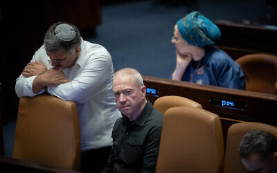 Defense Minister Yoav Gallant at a Knesset plenum vote on reviving an ultra-Orthodox military enlistment bill, early June 11, 2024. (Yonatan Sindel/Flash90)