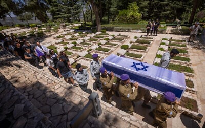 Illustrative: Family and friends of Israeli soldier Sergeant Almog Shalom attend his funeral at the Mount Herzl Military Cemetery in Jerusalem on June 11, 2024. (Chaim Goldberg/Flash90)