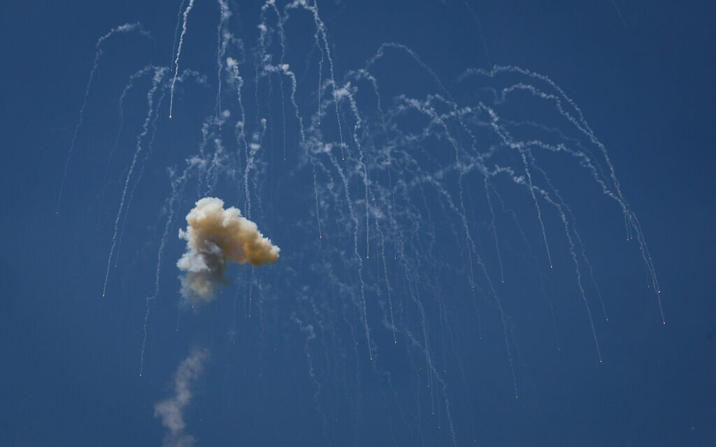 Interceptors target rockets from Lebanon as seen from the northern Israeli city of Safe on June 13, 2024. (David Cohen/Flash90)