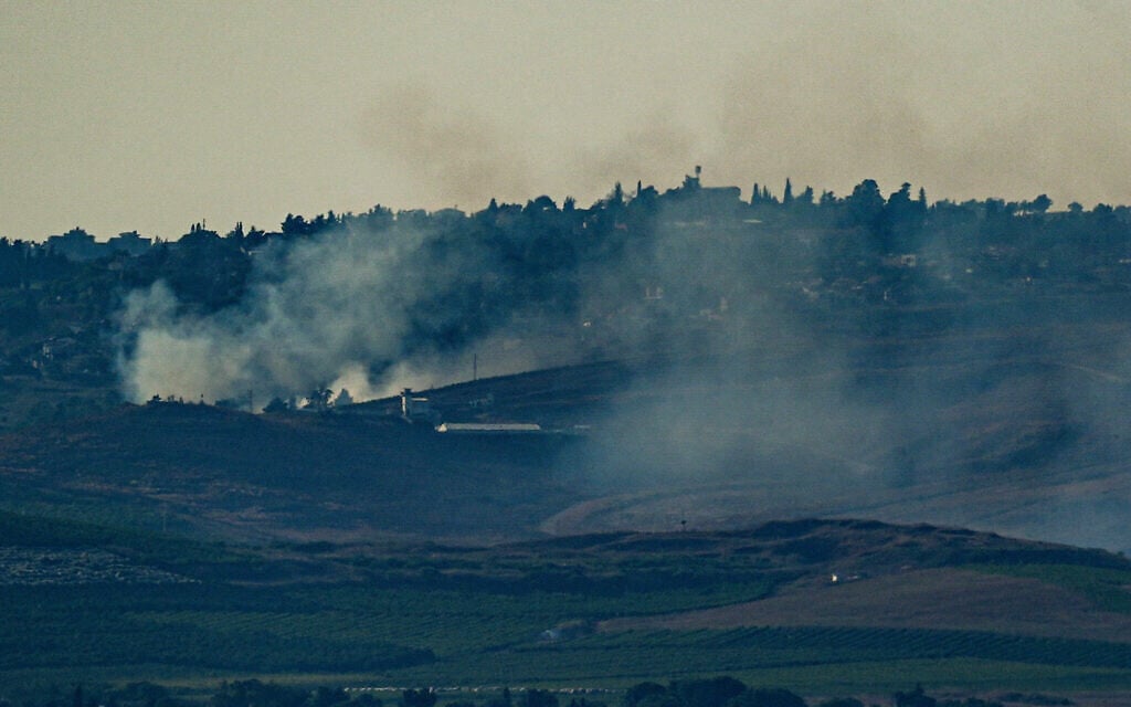 Smoke rises after a missile launched from Lebanon hit a house in Metula, near the border with Lebanon, June 26, 2024. (Ayal Margolin/Flash90)