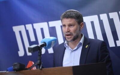 File - Finance Minister Bezalel Smotrich addresses the press ahead of his Religious Zionism's weekly faction meeting in the Knesset, June 10, 2024. (Chaim Goldberg/Flash90)