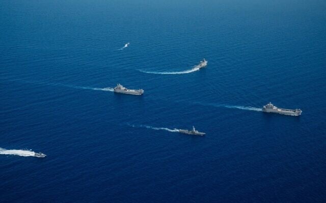 INS Komemiyut landing craft is seen being escorted into Israel's territorial waters by other Navy vessels, June 16, 2024. (Israel Defense Forces)