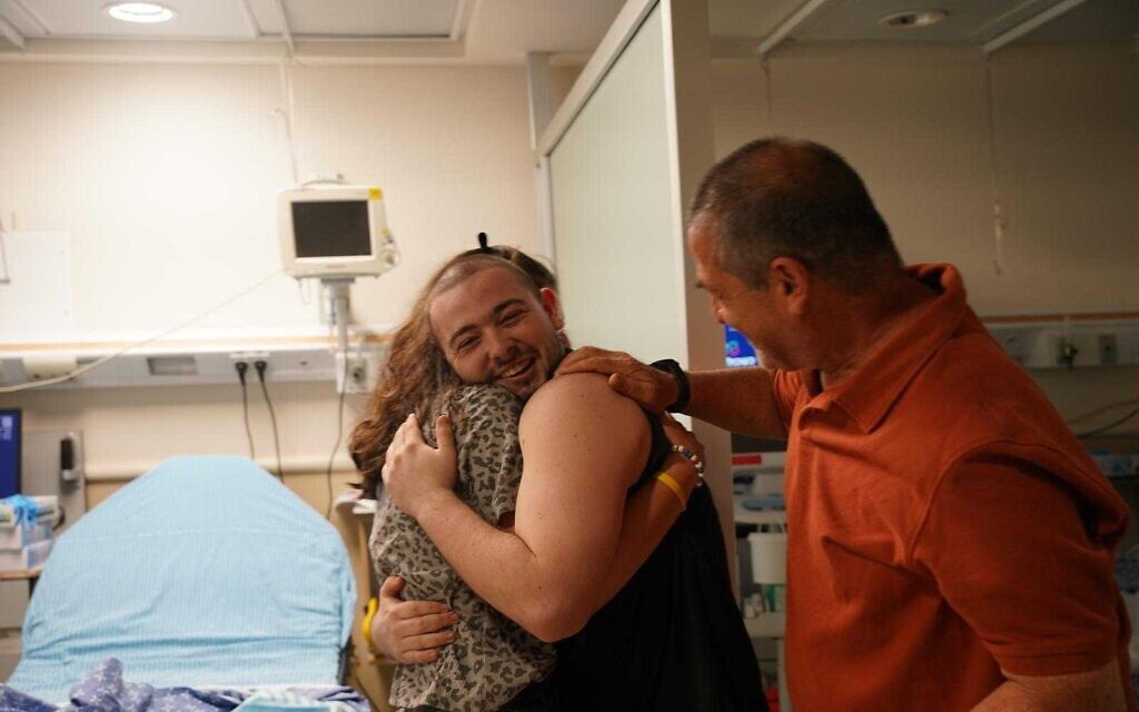 Almog Meir Jan reunites with his relatives at Sheba Medical Center after being rescued from Hamas captivity alongside Noa Argamani, Shlomi Ziv, and Andrey Kozlov, June 8, 2024. (IDF Spokesperson's Unit)