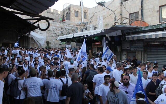 National religious Jews take part in the annual Jerusalem Day Flag March through the Arab Quarter of Jerusalem's Old City, June 5, 2024. (Sam Sokol/Times of Israel)