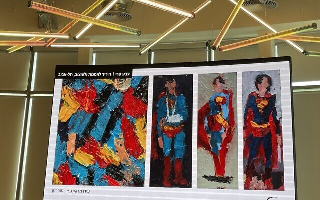 A group of paintings by Iddo Markus, featuring one of his familiar subjects, Superman, as human and superhero, at this year's Fresh Paint art fair, July 3-8, 2024 (Jessica Steinberg/Times of Israel)