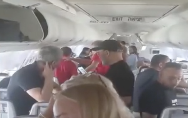 Passengers wait on the tarmac in Antalya, Turkey, after their El Al flight was forced to make an emergency landing and delayed from continuing the journey to Israel, June 30, 2024. (Screenshot: Channel 12, used in accordance with Clause 27a of the Copyright Law)