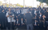 Haredi protesters are seen blocking Route 4 in a demonstration against the conscription of yeshiva students, in this screenshot from a video taken June 20, 2024. (Screenshot via X, Shilo Fried, used in accordance with Clause 27a of the Copyright Law)
