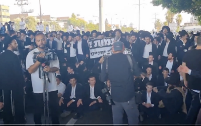 Haredi protesters are seen blocking Route 4 in a demonstration against the conscription of yeshiva students, in this screenshot from a video taken June 20, 2024. (Screenshot via X, Shilo Fried, used in accordance with Clause 27a of the Copyright Law)