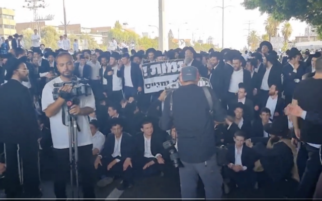 Haredi protesters are seen blocking Route 4 in a demonstration against the conscription of yeshiva students, in this screenshot from a video taken June 20, 2024. (Screenshot via X, Shilo Fried, used in accordance with Clause 27a of the Copyright Law) Haredi protesters are seen blocking Route 4 in a demonstration against the conscription of yeshiva students, in this screenshot from a video taken June 20, 2024. (Screenshot via X, Shilo Fried, used in accordance with Clause 27a of the Copyright Law)