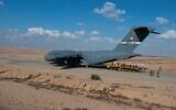 US Air Force members transfer cargo to the IDF at the Nevatim Air Base on October 15, 2023. (Edgar Grimaldo/US Air Force)
