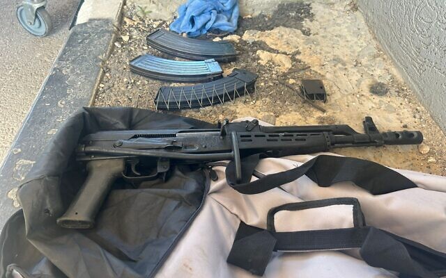 A Kalashnikov rifle and ammunition seized by security guards on the West Bank side of the Trans-Samaria Crossing, June 12, 2024. (Defense Ministry's Land Crossings Authority) A Kalashnikov rifle and ammunition seized by security guards on the West Bank side of the Trans-Samaria Crossing, June 12, 2024. (Defense Ministry's Land Crossings Authority)
