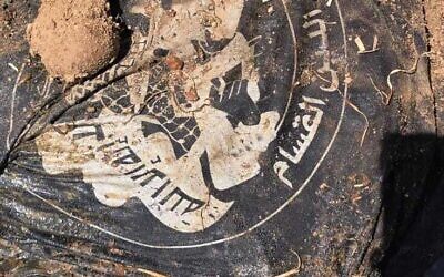 A shirt with Arabic writing on it found near a body discovered at Sha'ar Henegev, most likely belonging to an Oct. 7 terrorist (Israel Police)