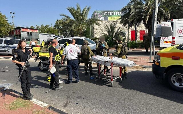 This handout photo shows emergency personnel near the Rantis checkpoint in the West Bank after an IDF soldier was struck by a car, June 14, 2024. (Magen David Adom) This handout photo shows emergency personnel near the Rantis checkpoint in the West Bank after an IDF soldier was struck by a car, June 14, 2024. (Magen David Adom)