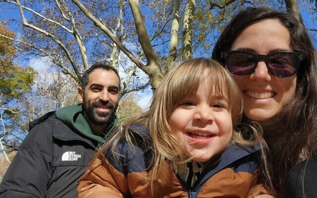 Omer Lubaton-Granot, left, and Shany Granot-Lubaton, right, with their son, Michael. (Courtesy via JTA)