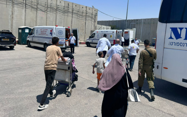 Sick and injured Palestinians being transferred from the Gaza Strip to Egypt, at Kerem Shalom border crossing, June 27, 2024. (COGAT) Sick and injured Palestinians being transferred from the Gaza Strip to Egypt, at Kerem Shalom border crossing, June 27, 2024. (COGAT)