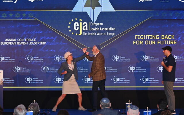 Rivkah de Reus blocks her husband Ernst de Reus during self-defense training given by an instructor from Belgium at a Jewish conference near Amsterdam on June 3, 2024. (Canaan Lidor/Times of Israel)