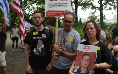 The family of 22-year-old Omer Neutra, who is being held hostage by Hamas, in Gaza speak at a rally in New York's Central Park on July 7, 2024. Left to right: Daniel Neutra, Ronen Neutra, and Orna Neutra. (Dani Tenenbaum and Liri Agami)