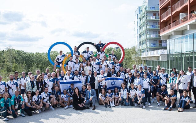 Israeli athletes pose for a photo at the Olympic Village in Paris on July 24, 2024. (Oded Karni/Olympic Committee of Israel)