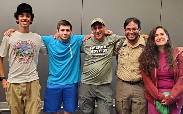Ariel Yaron (left), Moshe Grimaldi (second from left), Evan Gilder (center) were among five members of a Jewish contingent of Boy Scouts who participated in a CPR rescue aboard a flight to New York on July 11, 2024. (Courtesy Evan Gilder via JTA) Ariel Yaron (left), Moshe Grimaldi (second from left), Evan Gilder (center) were among five members of a Jewish contingent of Boy Scouts who participated in a CPR rescue aboard a flight to New York on July 11, 2024. (Courtesy Evan Gilder via JTA)