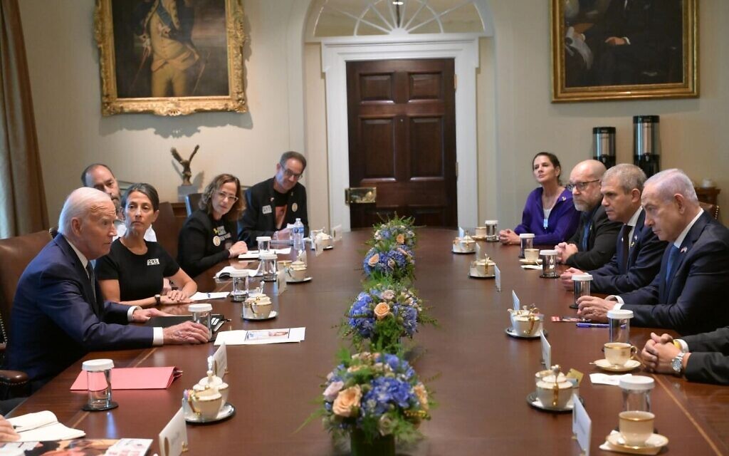 Prime Minister Benjamin Netanyahu (R) and US President Joe Biden (L) meet with families of American hostages at the White House, July 25, 2024. (Amos Ben Gershom/GPO)