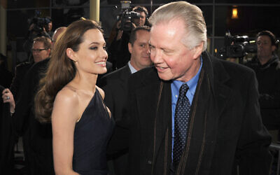 Angelina Jolie and her father Jon Voight arrive at the premiere of 'In the Land of Blood and Honey' at ArcLight Cinemas on December 8, 2011 in Hollywood, California.(KEVIN WINTER / Getty Images via AFP)