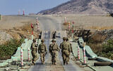 Illustrative - US soldiers patrol an area near Syria's northeastern Semalka border crossing with Iraq's Kurdish autonomous territory, on November 1, 2021. (Delil Souleiman/AFP)