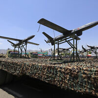 Drones are displayed on the back of a vehicle during an official military parade marking the ninth anniversary of the Houthi takeover of the capital, Sanaa, on September 21, 2023. (Mohammed Huwais/AFP)