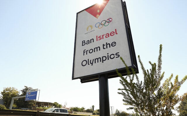 Illustrative: A general view of billboard that reads 'Ban Israel from the Olympics' on the M1 North De Villiers Graaf motorway in Johannesburg, South Africa on April 22, 2024. (Phill Magakoe/AFP) Illustrative: A general view of billboard that reads 'Ban Israel from the Olympics' on the M1 North De Villiers Graaf motorway in Johannesburg, South Africa on April 22, 2024. (Phill Magakoe/AFP)