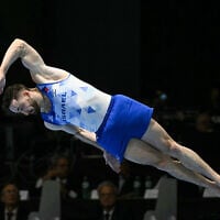 Israel's Artem Dolgopyat competes on the Floor during the Men's Team Finals event at the Artistic Gymnastics European Championships, in Rimini, on the Adriatic coast, northeastern Italy, on April 28, 2024. (Gabriel Bouys/AFP)
