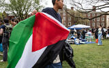 Pro-Palestinian, anti-Israel students take down their encampment after reaching a deal with Brown University in Providence, Rhode Island on April 30, 2024. (Joseph Prezioso / AFP)