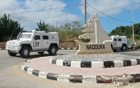 UNIFIL armored vehicles patrol on the entrance of the southern Lebanese town of Naqoura near the border with Israel on June 17, 2024. (Mahmoud Zayyat/AFP)