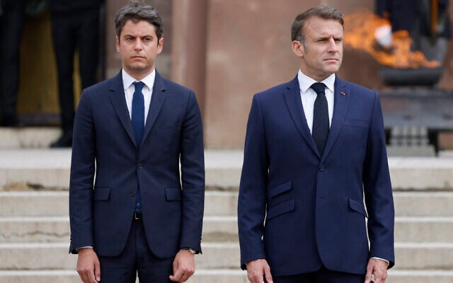 French President Emmanuel Macron (R) and France's Prime Minister Gabriel Attal attend a ceremony at the Mont-Valerien memorial in Suresnes, outside Paris, on June 18, 2024. (Ludovic MARIN / POOL / AFP) French President Emmanuel Macron (R) and France's Prime Minister Gabriel Attal attend a ceremony at the Mont-Valerien memorial in Suresnes, outside Paris, on June 18, 2024. (Ludovic MARIN / POOL / AFP)