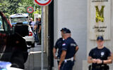 Police officers on a street near the Israeli embassy in Belgrade, on June 29, 2024. (OLIVER BUNIC / AFP)