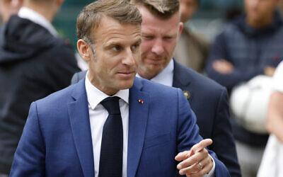 France's President Emmanuel Macron leaves the polling station after voting for the first round of parliamentary elections in Le Touquet, northern France on June 30, 2024. (Ludovic Marin / AFP)