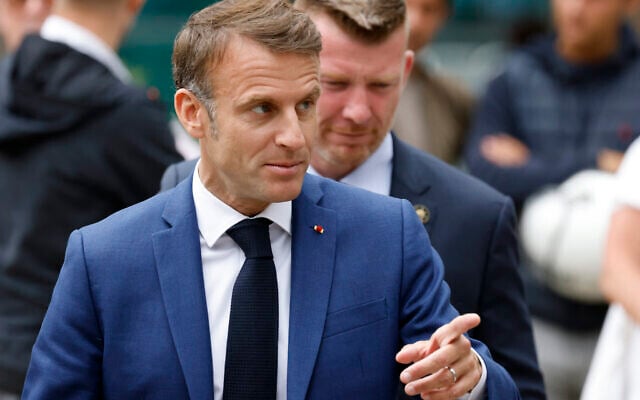 France's President Emmanuel Macron leaves the polling station after voting for the first round of parliamentary elections in Le Touquet, northern France on June 30, 2024. (Ludovic Marin / AFP) France's President Emmanuel Macron leaves the polling station after voting for the first round of parliamentary elections in Le Touquet, northern France on June 30, 2024. (Ludovic Marin / AFP)