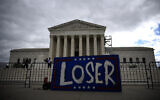 A placard reading 'Loser' is seen in front of the US Supreme Court in Washington, July 1, 2024. (Drew Angerer / AFP)