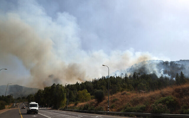 Smoke billows after rockets launched by terrorists in southern Lebanon hit areas in the Upper Galilee in northern Israel on July 4, 2024. (Jack Guez/AFP)
