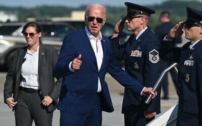 US President Joe Biden gives a thumbs up as he boards Air Force One at Harrisburg International Airport in Harrisburg, Pennsylvania, on July 7, 2024, as he returns to Washington, DC.(Saul Loeb/AFP)