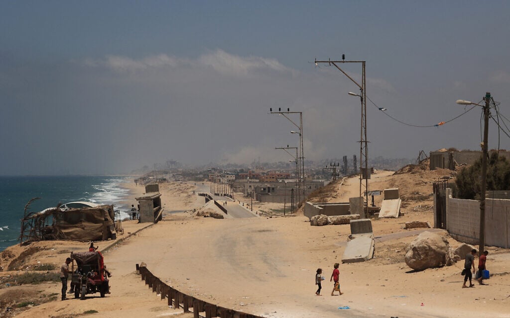 A picture taken from Nuseirat in the central Gaza Strip shows smoke during Israeli strikes on Gaza City on July 8, 2024 (Eyad BABA / AFP)