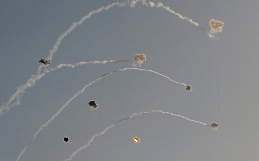 Rockets fired from southern Lebanon are intercepted by Israel's Iron Dome air defense system over the Upper Galilee region in northern Israel, on July 8, 2024. (Jalaa MAREY / AFP)