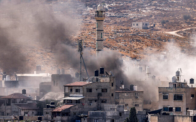 Smoke plumes billow during an Israeli army raid in Nur Shams, east of Tulkarm in the West Bank on July 9, 2024. (Jaafar ASHTIYEH / AFP) Smoke plumes billow during an Israeli army raid in Nur Shams, east of Tulkarm in the West Bank on July 9, 2024. (Jaafar ASHTIYEH / AFP)