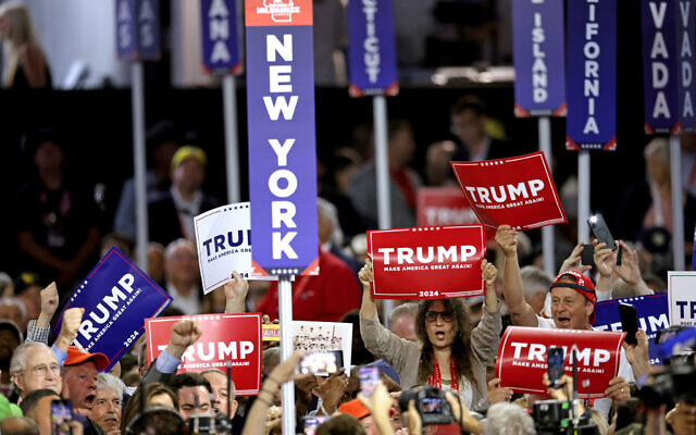 Delegates from New York cheer during the roll call vote in the first day of the 2024 Republican National Convention at the Fiserv Forum in Milwaukee, Wisconsin, July 15, 2024. (KAMIL KRZACZYNSKI / AFP)