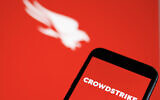 This photograph shows a screen displaying a logo of 'CrowdStrike' cybersecurity technology company in Munich on July 19, 2024, amid massive global IT outage. (Michaela Stache/AFP)