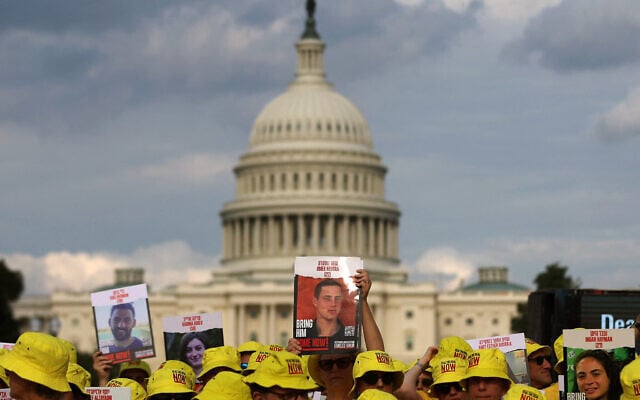 People hold pictures of Israeli hostages during a vigil on the National Mall on July 23, 2024 in Washington, DC. (Justin Sullivan/ GETTY IMAGES NORTH AMERICA / Getty Images via AFP) People hold pictures of Israeli hostages during a vigil on the National Mall on July 23, 2024 in Washington, DC. (Justin Sullivan/ GETTY IMAGES NORTH AMERICA / Getty Images via AFP)