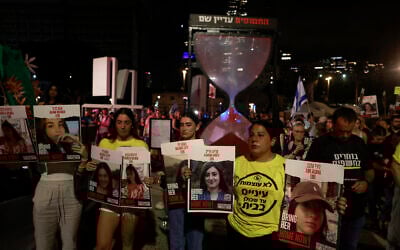 Families and supporters of Israeli hostages gather in Tel Aviv to watch a live transmission on a large screen of Israeli Prime Minster Benjamin Netanyahu's speech to the US Congress on July 24, 2024 (Menahem Kahana / AFP)