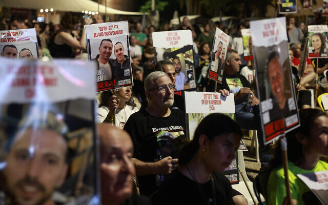 Families and supporters of Israeli hostages held by Hamas in the Gaza Strip since October 7, gather in Tel Aviv at the 'hostages square' to watch a live transmission on a large screen of Prime Minster Benjamin Netanyahu's speech to the US Congress on July 24, 2024. (Menahem Kahana/AFP)