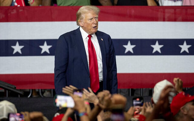 Former US president and 2024 Republican presidential candidate Donald Trump takes in the crowd after speaking during a campaign rally at the Bojangles Coliseum in Charlotte, North Carolina, on July 24, 2024. (Logan Cyrus / AFP)